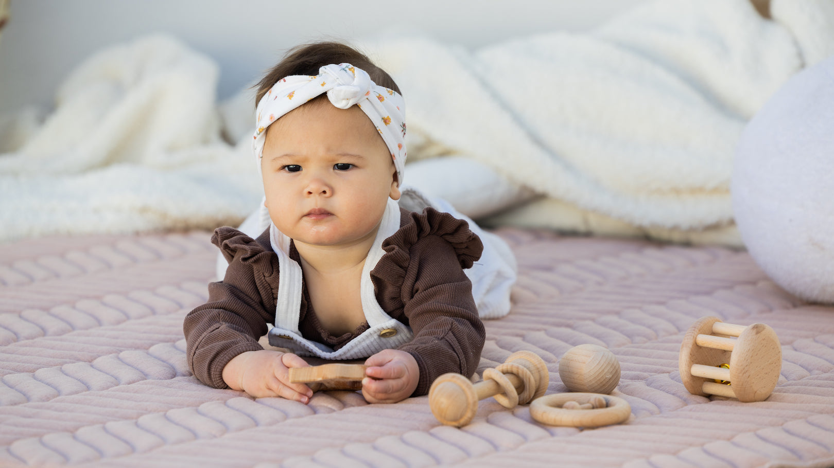 baby on The Kairos Child's Pampas play mat during tummy time session