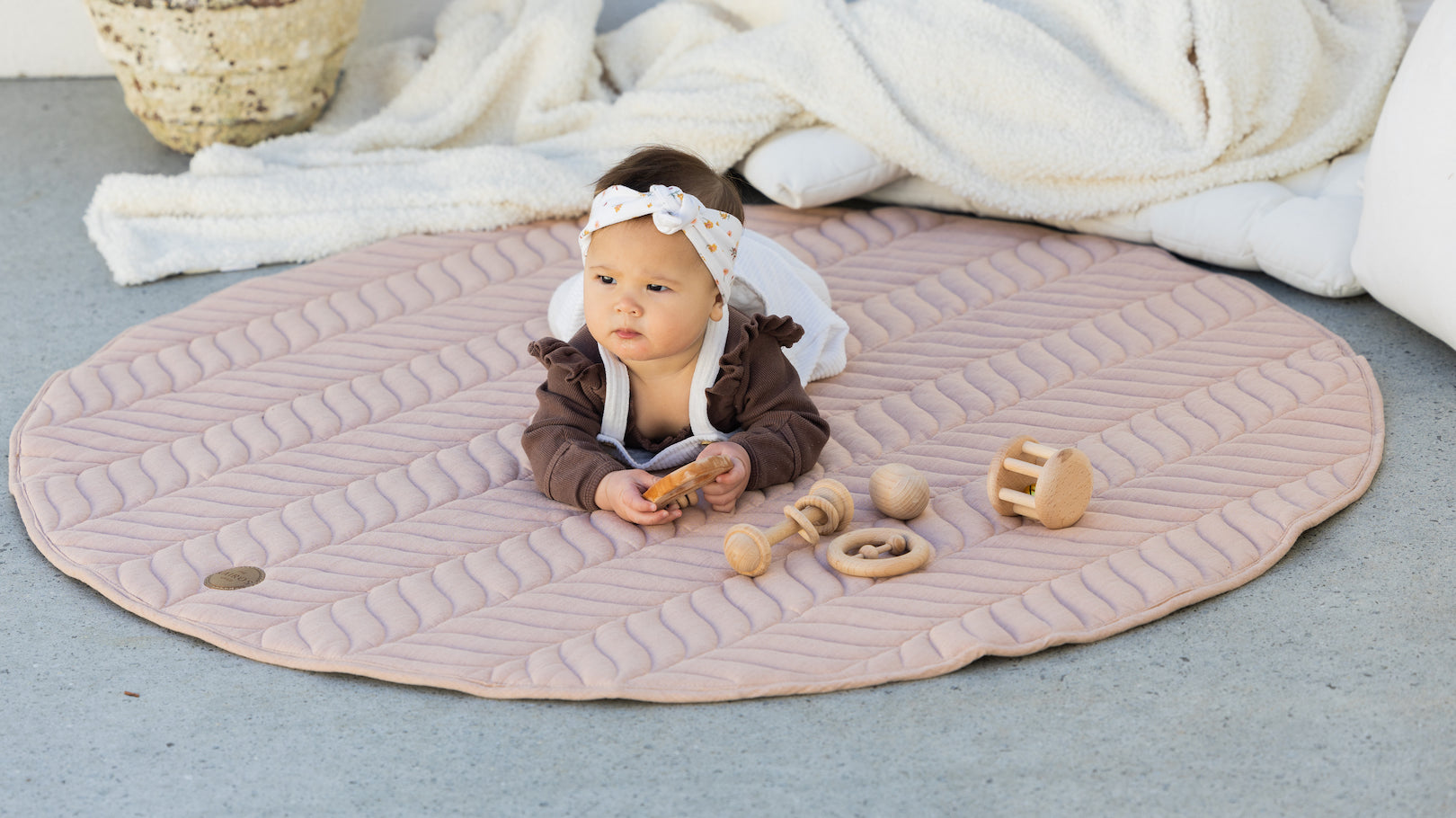 Baby learning to crawl on Kairos Child Pampas Play Mat